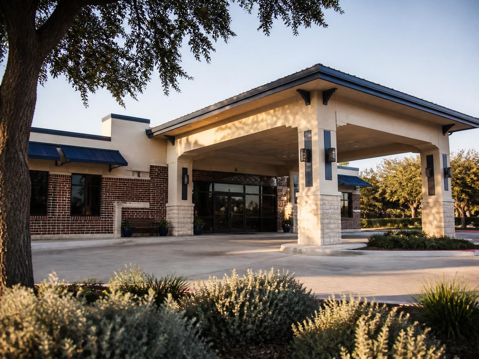 Exterior of a local Texas dialysis and medical clinic with a covered patient drop-off portico